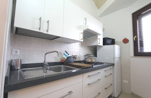 Diso Apartment | Discover Residence Borgo Antico: Family-Friendly Getaway
