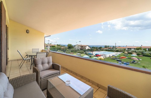 Moniga del Garda Apartment | Discover Residence Primera: Oceanfront Escape with Spa