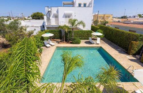 Santa Maria al Bagno Apartment | Discover Residence Viva: Pools, Garden & Ocean Views