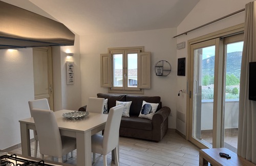 Limpiddu Apartment | Experience Residenza Limpiddu: Pool and Sea Views Await