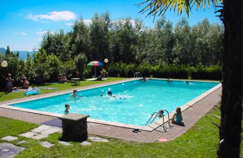 Colmegna Apartment | Cozy Residenza Paradiso with Pool & Child-Friendly Fun