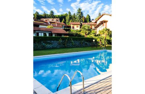 Colmegna Apartment | Cozy Residenza Paradiso with Pool & Child-Friendly Fun