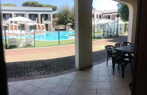 Lido di Spina Apartment | Cozy Beachside Apartment with Pool and Kitchen Amenities