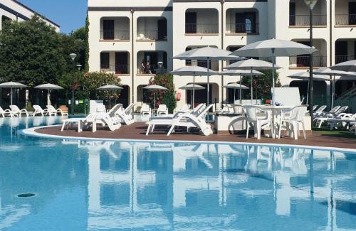 Lido di Spina Apartment | Cozy Beachside Apartment with Pool and Kitchen Amenities