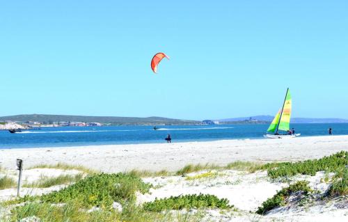 Langebaan Apartment | Retro Rest: Oceanfront Escape with Pool & Family Amenities