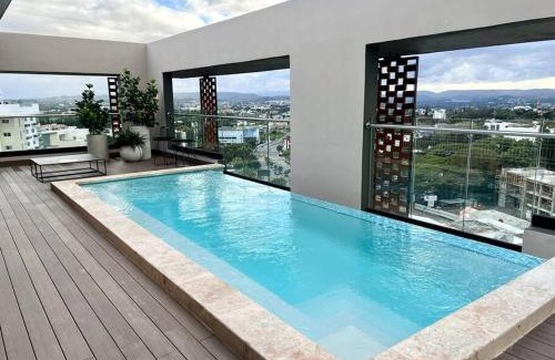 Santiago Province Apartment | Rialto Residences: Oceanfront Retreat with Pool & Gym
