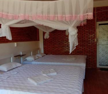 Quan Tom Resort | Charming Rice Straw Green Lodge with Family-Friendly Amenities
