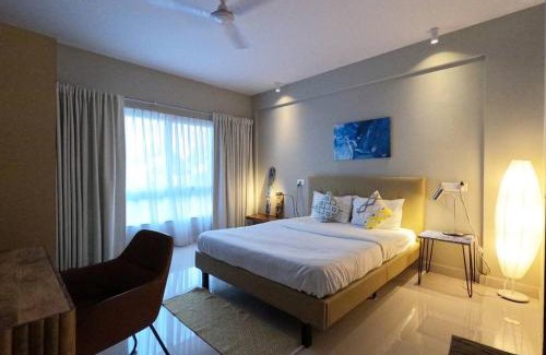 Nerul Apartment | Ripples: Poolside Retreat with River Views Near Coco Beach