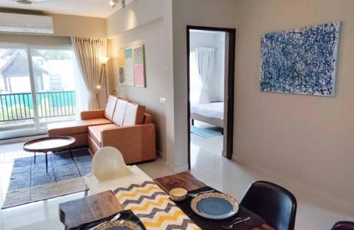 Nerul Apartment | Ripples: Poolside Retreat with River Views Near Coco Beach