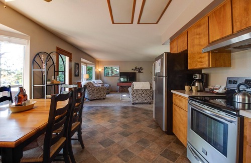 River West House | RiverBend Bungalow: Riverfront Retreat with Hot Tub & Wifi