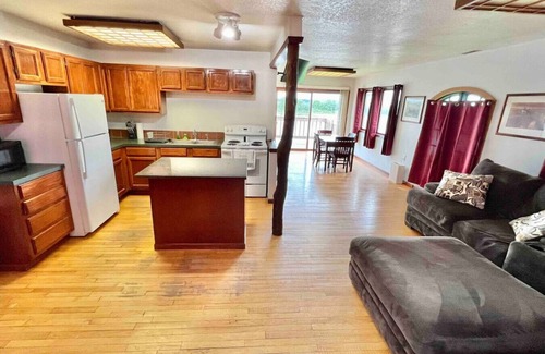St. Joseph Cabin | Relaxing Riverfront Cabin with Jacuzzi and Family Amenities