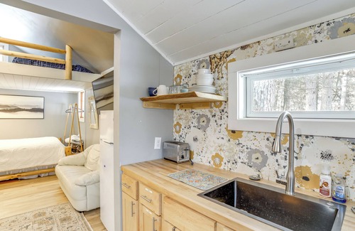 Big Rapids Apartment | Riverfront Big Rapids Cabin w/Fire Pit!