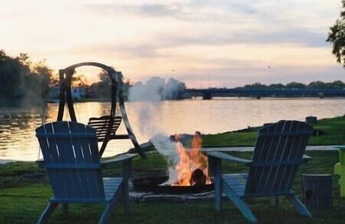 Quad Cities House | Enchanting Waterfront Cottage with Magical Sunsets