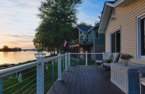 Quad Cities House | Enchanting Waterfront Cottage with Magical Sunsets