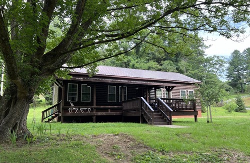 Newland Cabin | Exquisite Riverfront Log Cabin with Fire Pit & Deck