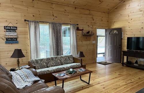 Newland Cabin | Exquisite Riverfront Log Cabin with Fire Pit & Deck