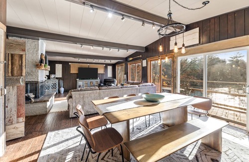 Black River Falls Cabin | Riverfront Retreat with Beach, Tiki Bar & Recreation Room