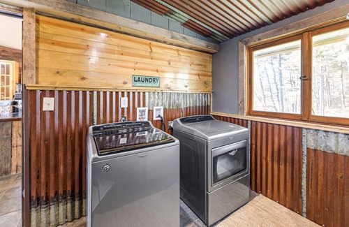Black River Falls Cabin | Riverfront Retreat with Beach, Tiki Bar & Recreation Room