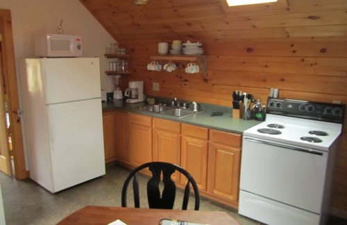Deposit Cabin | Rivers Edge: Premier Stay with Private Boat Launch & Pet-Friendly