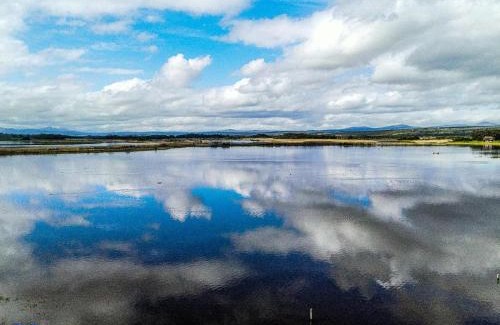 Overstrand House | Eco-Friendly Rivers End Farm with Ocean Views & Hot Tub