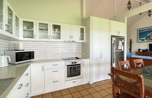Burrum Heads Villa | Riverside Retreat: Riverfront 3BR with Ocean Views