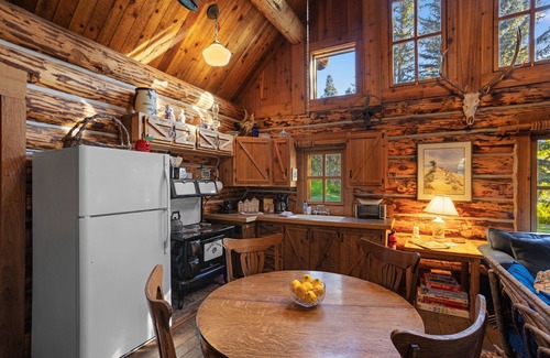Livingston House | Riverside log cabin, pool, pickle ball court, ultimate mountain experience