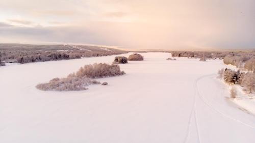 Rovaniemi Apartment | Elegant Riverside Suites with Private Beach & Ocean View