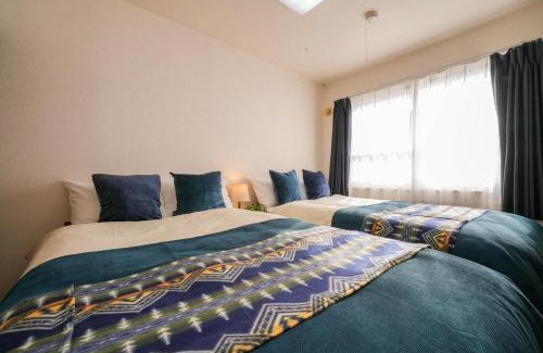 Shinhidaka Apartment | Cozy Riverside Mansion - Family-Friendly Vacation Retreat