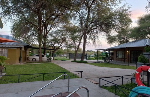 Maun Cottage | Riverside Splash - Cozy Cottages with Pool and River View