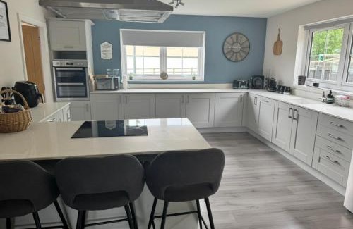 Wooler House | Riverside View - Modern 4-Bedroom House with Hot Tub
