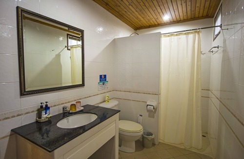 Thap Sakae Resort | Inviting Rocky Point Resort with Ocean Views & Pool Access