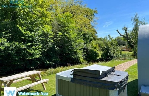 Legbourne Cabin | Enchanting Riverside Retreat with Private Hot Tub