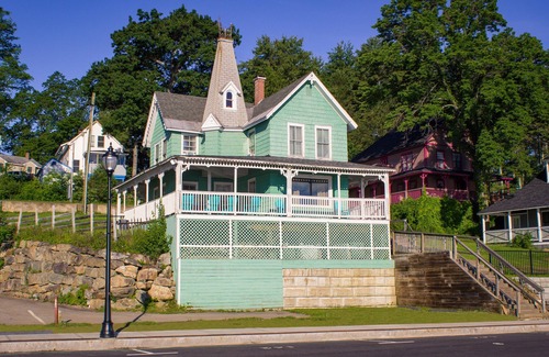 Weirs Beach House | Idyllic Romeo's Balcony: Oceanfront Retreat at Weirs Beach