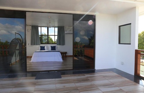 Thulusdhoo Island House | Master Suite Family Room with Lagoon and Ocean Views