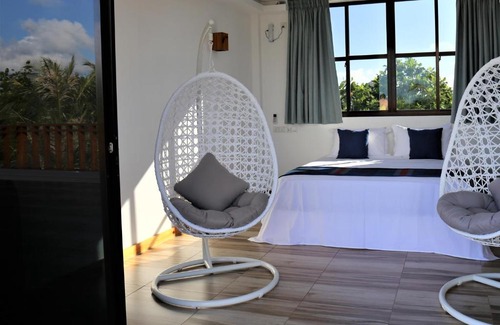 Thulusdhoo Island House | Master Suite Family Room with Lagoon and Ocean Views