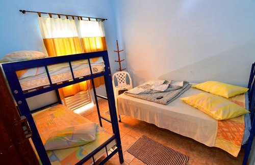 Aparecida House | Inviting Room with Balcony and Kitchen at Hotel Frei Galvão