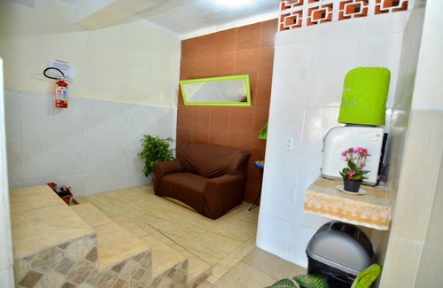 Aparecida House | Inviting Room with Balcony and Kitchen at Hotel Frei Galvão