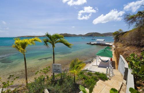 Calivigny Apartment | Experience Rose Quartz Condo Suite: Oceanfront & Spa Retreat
