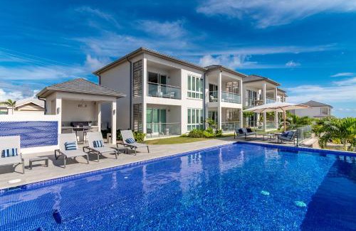Calivigny Apartment | Experience Rose Quartz Condo Suite: Oceanfront & Spa Retreat