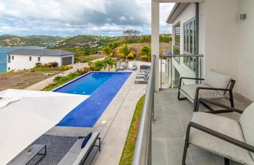 Calivigny Apartment | Experience Rose Quartz Condo Suite: Oceanfront & Spa Retreat