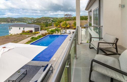 Calivigny Apartment | Experience Rose Quartz Condo Suite: Oceanfront & Spa Retreat