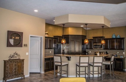 Mesquite House | Experience Roulette Retreat: Featured Suites & Putting Green