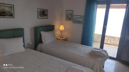 Ag. Georgios Apartment | Rousalis Studio: Oceanfront Retreat in Corfu, Greece