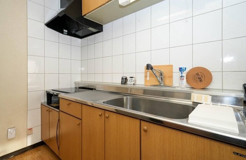 Shinhidaka Apartment | Experience Riverside Mansion with Breakfast & Parking Included