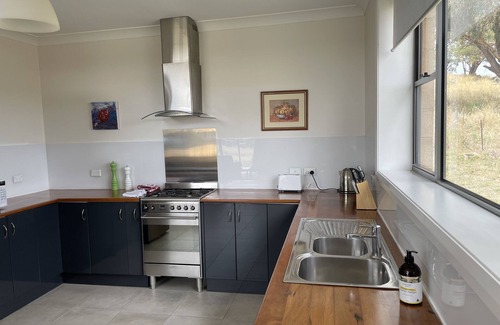 Orange House | Family-Friendly Retreat with Scenic Rural Views