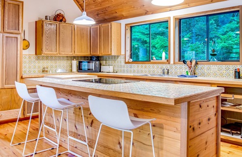 Marrowstone Cabin | Rustic cabin with wraparound deck and wood stove in a tranquil location