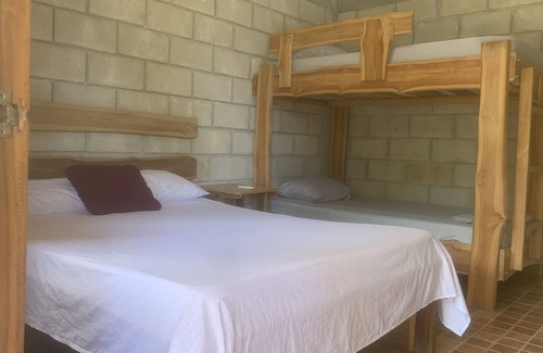 Marbella Cabin | Tranquil Jungle Lodge Family Room with Ocean View Amenities