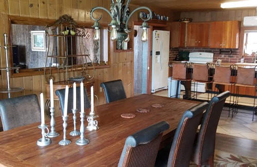 Osage Beach House | Cozy Log Cabin with Ocean Views and Pet-Friendly Amenities