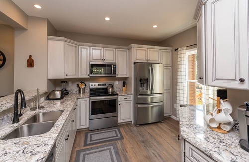 McHenry House | Cozy Lake Retreat with Hot Tub, Pool & Spa Amenities