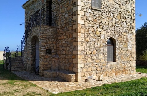 Sassari House | Ideal Retreat: Rustico in Pietra near the Sea with Kids' Amenities